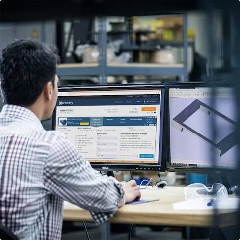 Rear view of a Person using a desktop computer